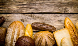 Bakery products on wooden background.